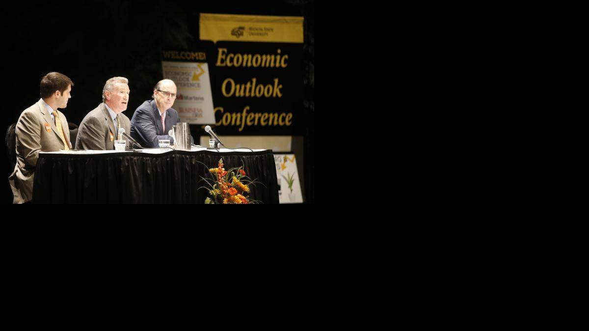 
From left, Jon Rolph of Sasnak, Jerry Jones of Slawson and Jack Kleinhenz, chief economist of the National Retail Federation, answer questions during Wichita State University's Wichita Area Economic Outlook Conference at Century II. (Oct. 9, 2014)
