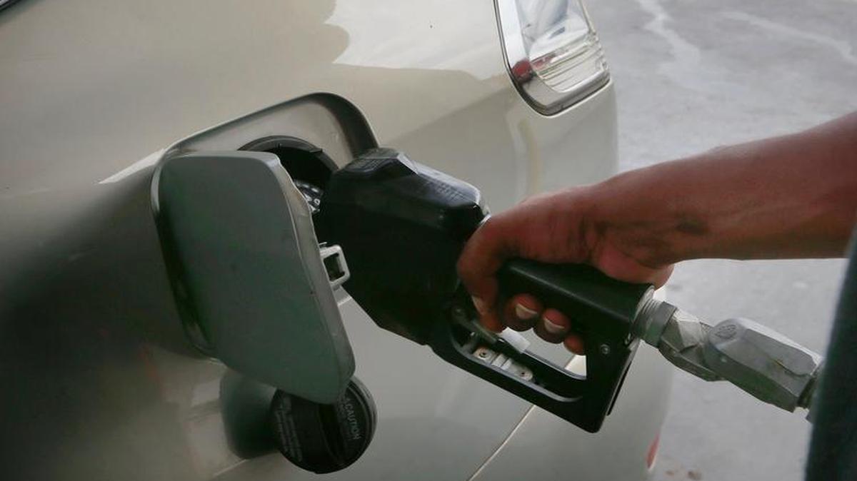 
A motorist fills up his car in July at the QuikTrip near Douglas and Broadway. Average retail gasoline prices in Wichita fell 9.5 cents per gallon last week, according to a GasBuddy report on Monday. 
