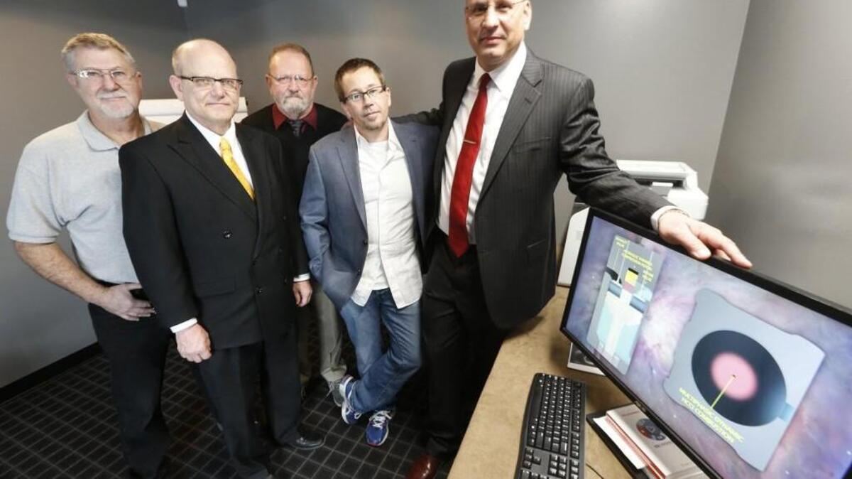 With Inventor Matthew Riley (right) are, from left, Terry Morris, Paul Good, Dave Bennett, Klaus Viljanmaa.