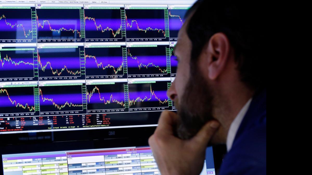 
Michael Pistillo watches his screens at his post on the floor of the New York Stock Exchange. As the stock market climbs higher, professional investors are warning that companies are presenting misleading versions of their results that ignore a wide variety of normal costs of running a business to make it seem like they’re doing better than they really are. 
