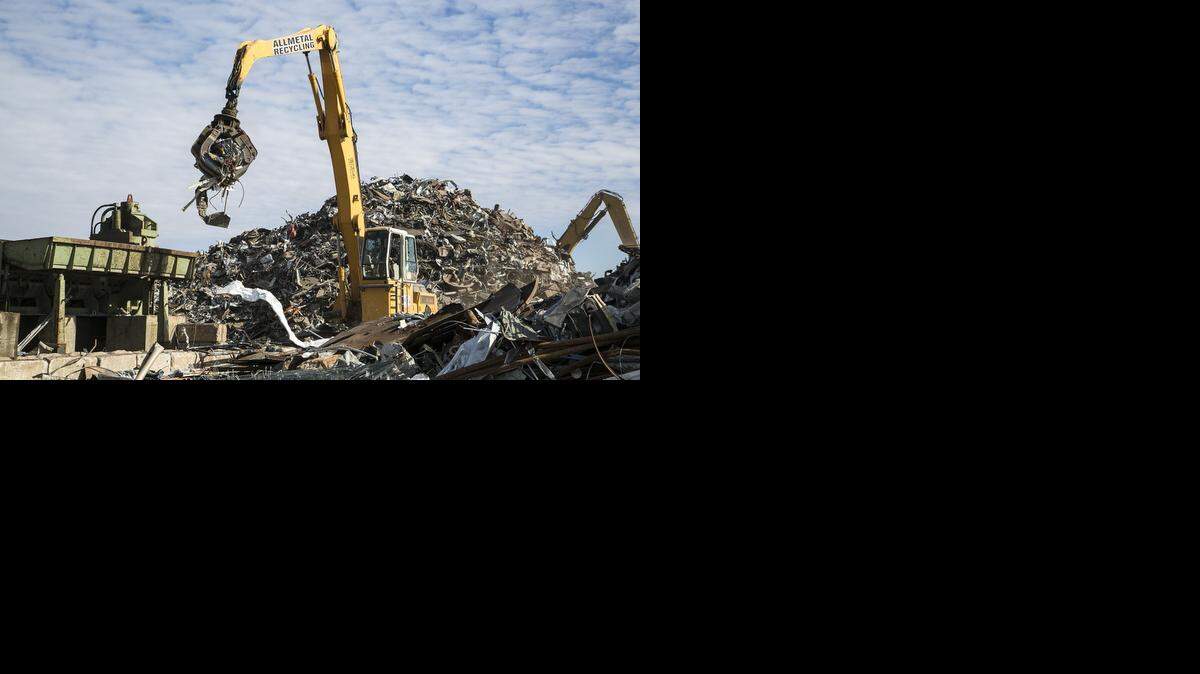 
Scrap metal is dropped into a shredder at Allmetal Recycling. 
