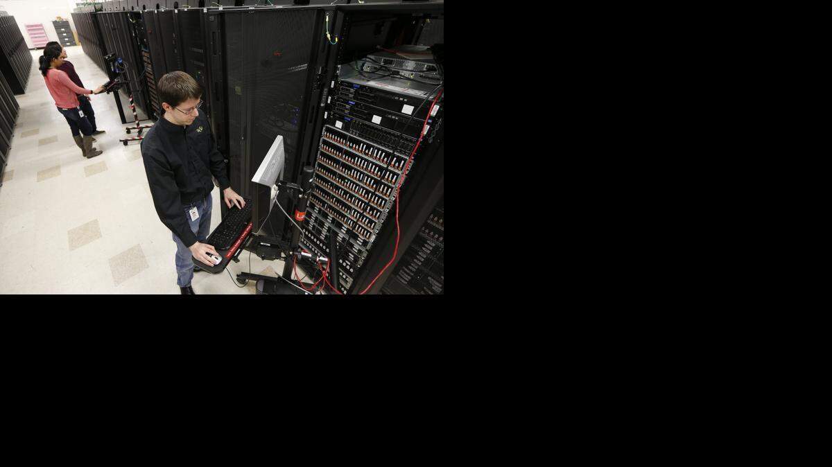 
Chris Newlin, a software test engineer, works in the NetApp server test facility on North Rock Road. (Feb. 17, 2015)
