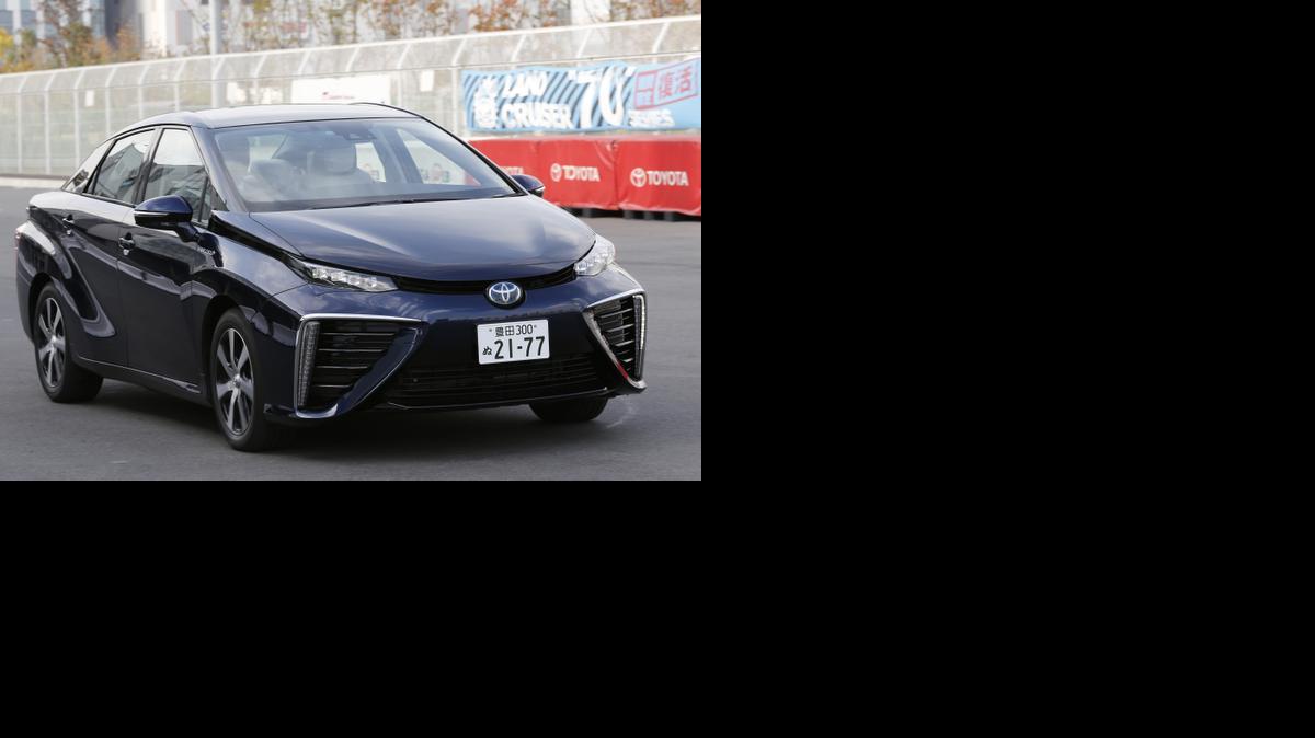 
Toyota’s new fuel cell vehicle Mirai drives at its showroom test course in Tokyo. The world’s largest automaker announced Tuesday, Nov. 18 that it will begin selling fuel cell cars in Japan on Dec. 15 and in the U.S. and Europe in mid-2015. The sporty-looking, four-door Toyota Mirai will retail $57,600.
