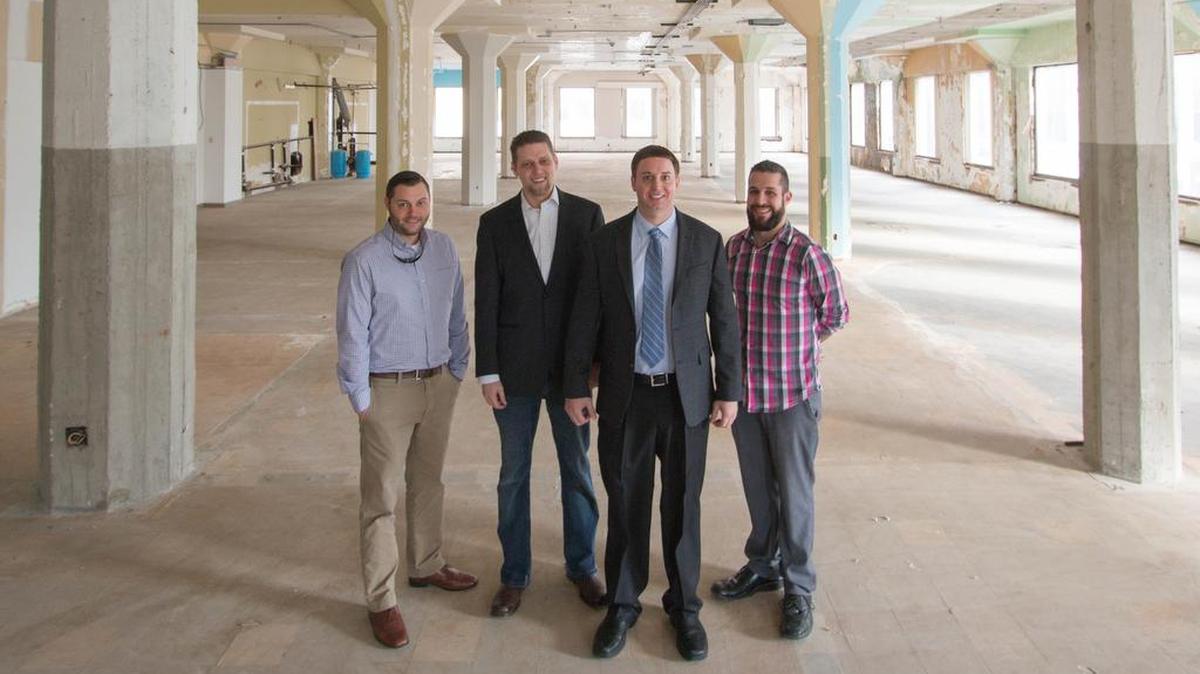 Trucking brokerage King of Freight will move into new offices at the corner of William and Market around March 1. Shown are, from left, sales manager Brady Miller, partner Greg Bolain, owner Mike Ricklefs and sales manager Grant Kocher.
