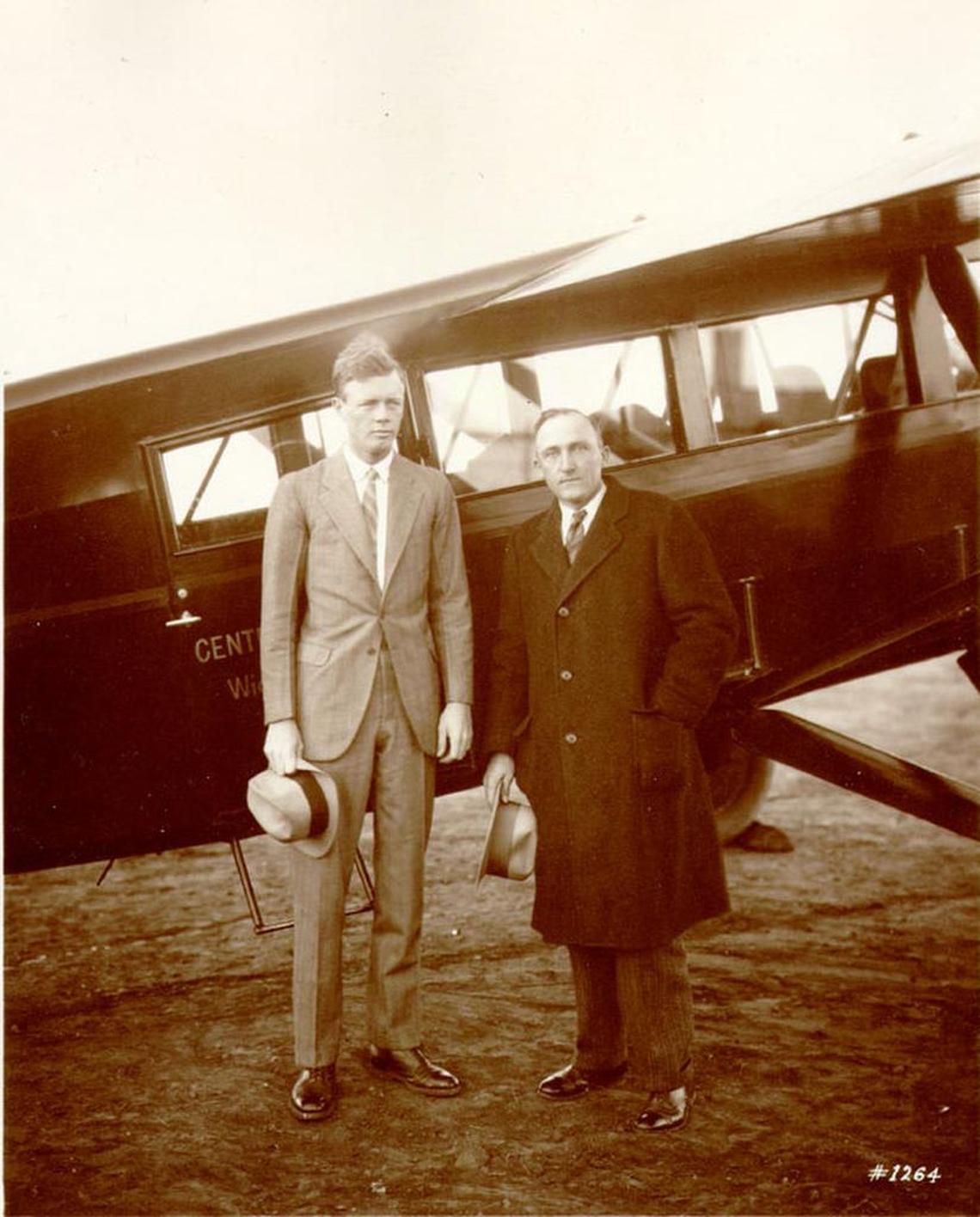 Charles A. Lindbergh (left) and Walter H. Beech pose in front of Travel Air 6000 airplane. Photograph taken in Wichita on February 3, 1929.