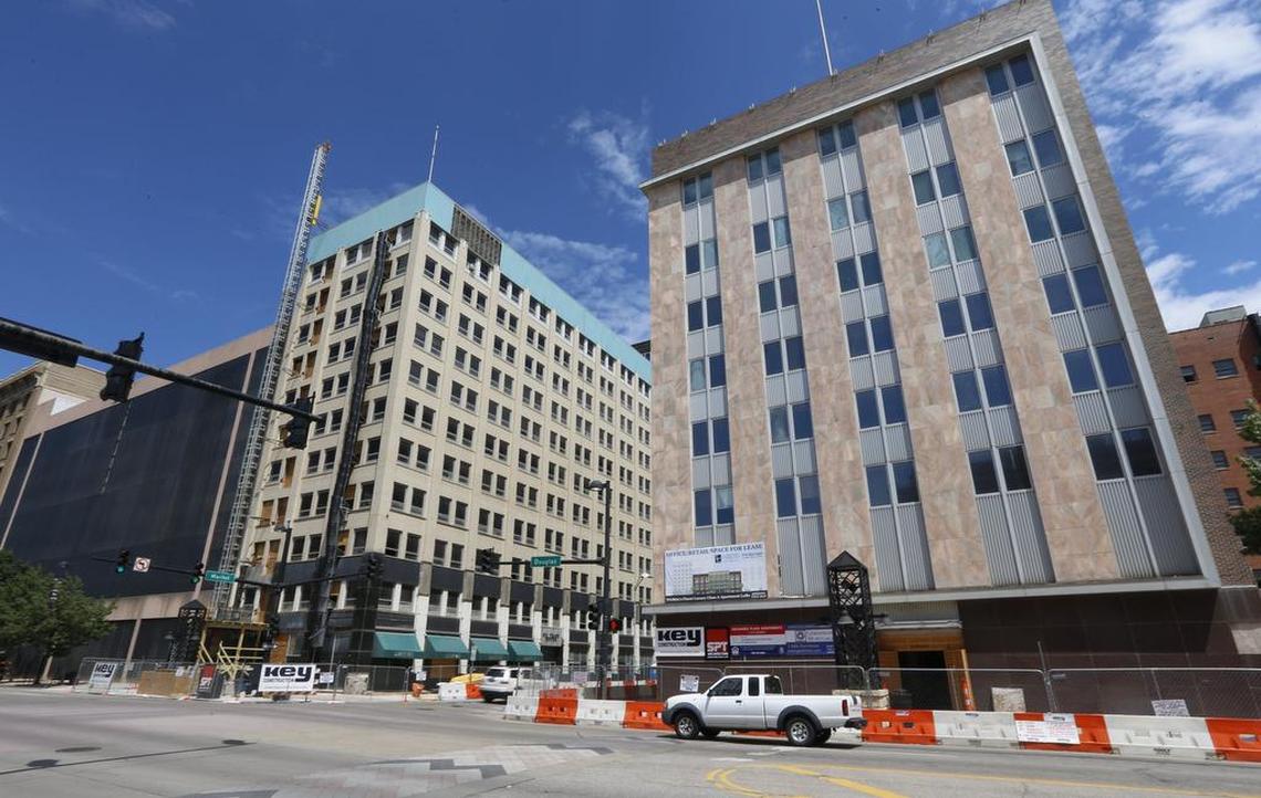 Looking north at Douglas and Market shows Exchange Place (right) and the Bitting Building (left) under construction on both corners. (July 14, 2015)