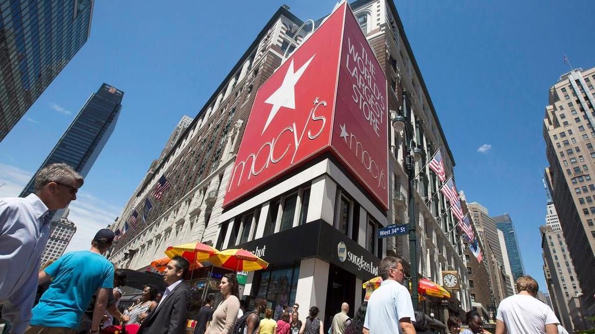 
Pedestrians walk through Herald Square past a Macy's department store in New York. Retail sales in July rose on growing demand for everything from cars to clothing. 
