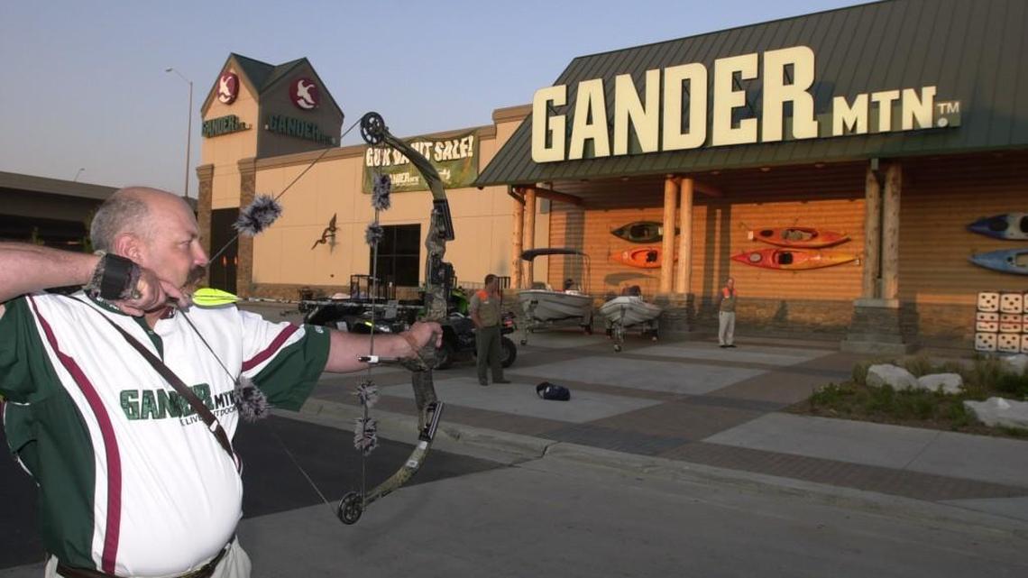 Extreme bow-hunter Ray Howell prepares to shoot the red ribbon at the grand opening of Gander Mountain in Wichita in 2005. Just 12 years later, it is still unclear whether the store will remain open. (Sept. 9, 2005)