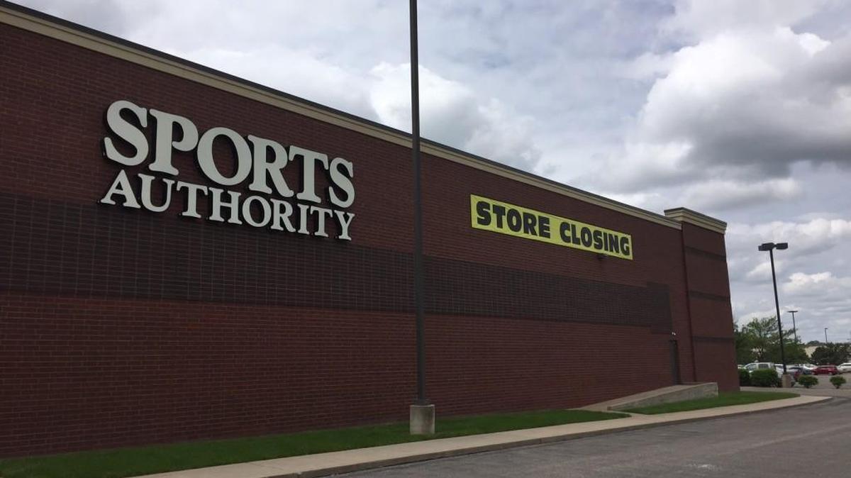 A store closing banner hangs on the outside of the Sports Authority store on East 21st Street between Woodlawn and Rock Road in Wichita on Monday afternoon.