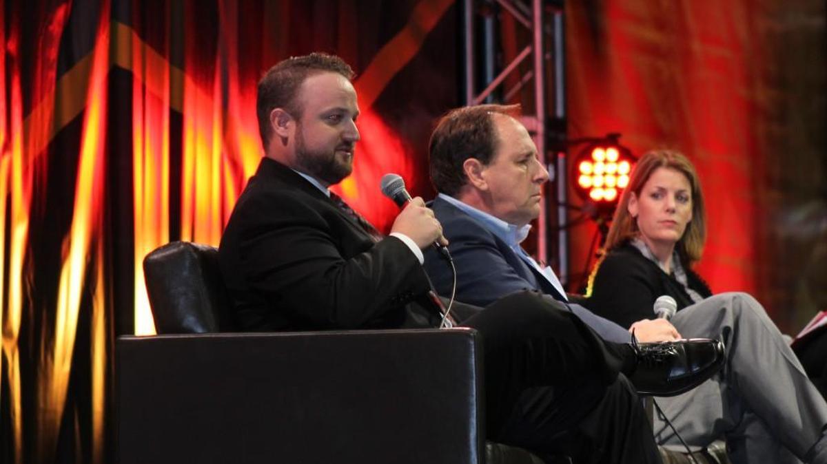Vermillion Inc. CEO Jared Peterson, left, speaks during a panel on manufacturing at the 38th annual Kansas Economic Outlook Conference on Thursday at Intrust Bank Arena. Also picture are Tim Penner, president and CEO of Harper Industries, and Carolyn Lee, executive director of the Manufacturing Institute.