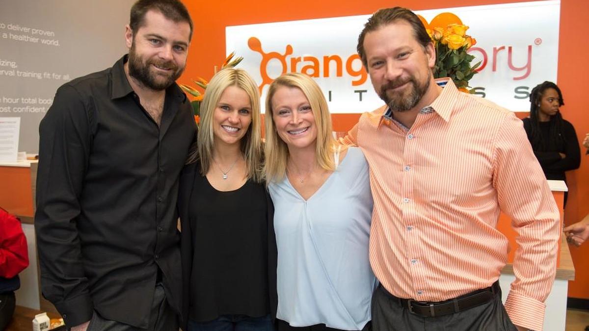 From left, Pat Walsh, Annie Walsh, Haylee Shaver and Joe Froehle have opened Orangetheory Fitness at Waterfront Plaza at 13th and Webb.