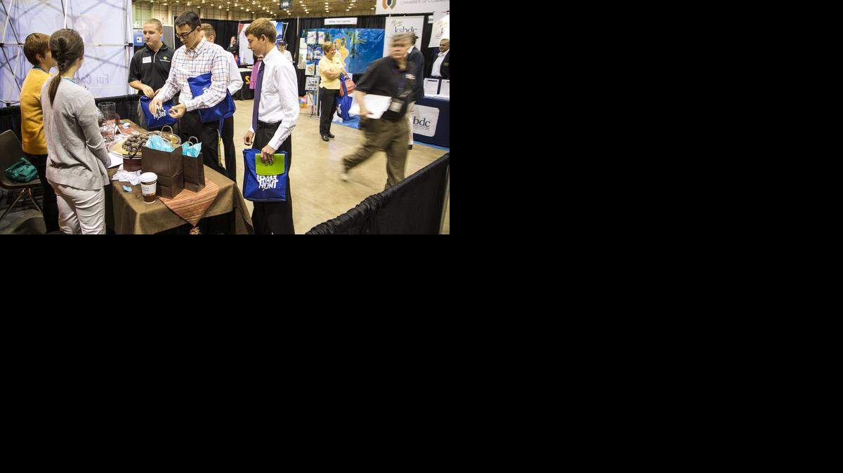 
Visitors on Thursday check out the Cocoa Dolce booth at the Wichita Area Metro Chamber of Commerce’s small business exposition called Exposure. (Sep. 25, 2014)
