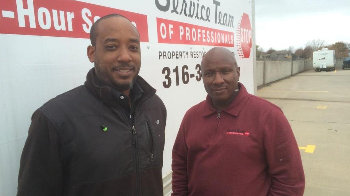 Primus Singleton III, right, and his son, Primus Singleton IV, have opened a STOP Restoration franchise in Wichita.