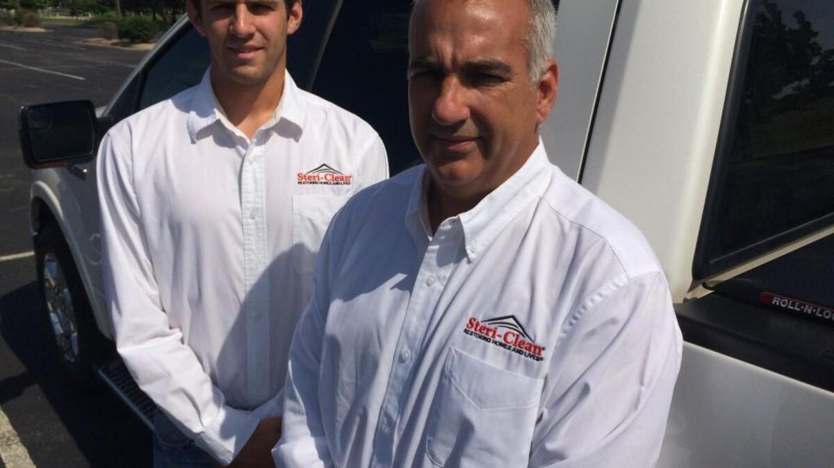 Mark Elpers, right, and his son, Luke, opened a Steri-Clean franchise last year.
