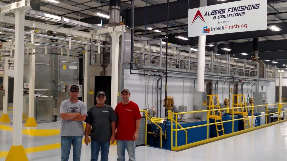 Owners Bret Albers, left, and Craig Albers, right, flank employee Randy Lubbers at Albers Finishing & Solutions in Cheney.