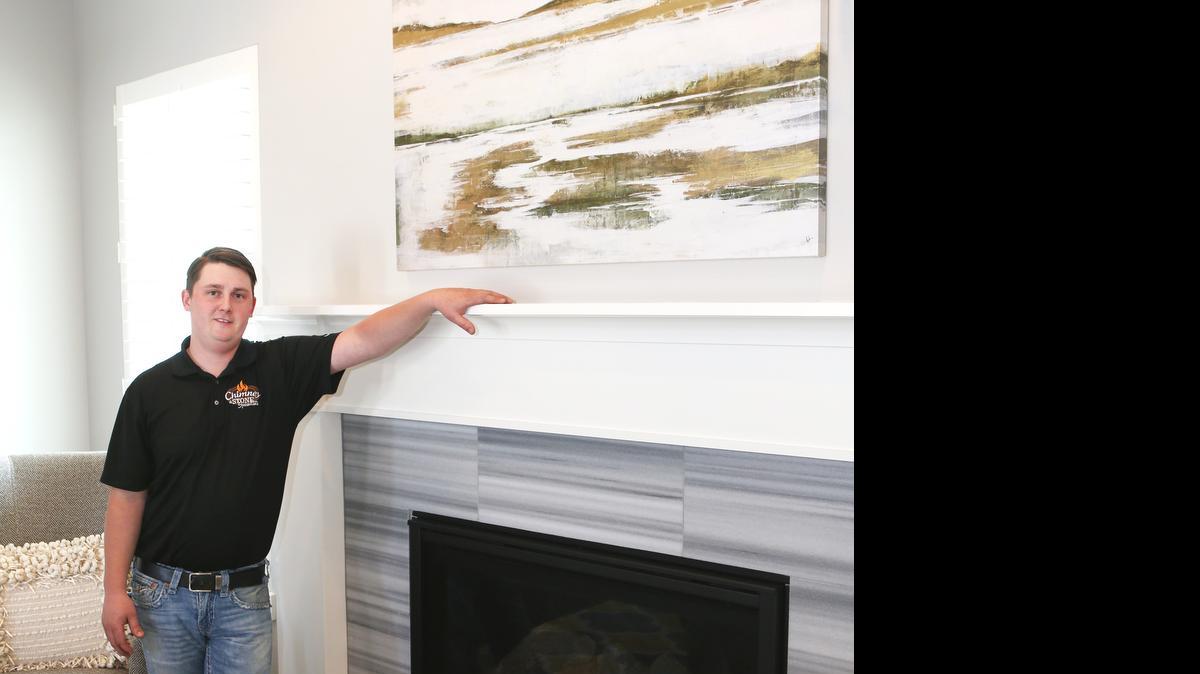 
Chimney & Stone Specialists owner Brady Baus stands by a chimney he installed in a Ritchie Development model home in the Garden Walk neighborhood. 
