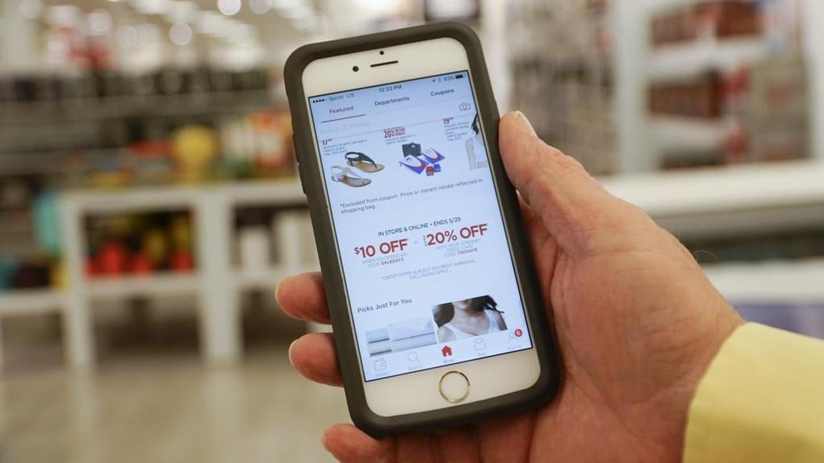 The JC Penney app is shown on a smartphone inside the JC Penney store at Towne East Mall. More than 70 percent of the customers who visit the store visited the app first.