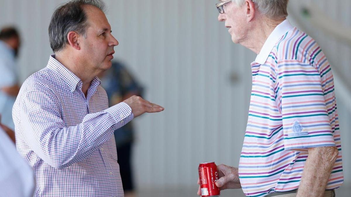 
Textron Avation CEO Scott Ernest, left, talks with Jack DeBoer at a Wichita Aero Club reception in July. DeBoer said he was lucky enough not to have to wait until a traditional retirement age to start working on a bucket list, so he doesn’t have one. “I might just as well continue working.”
