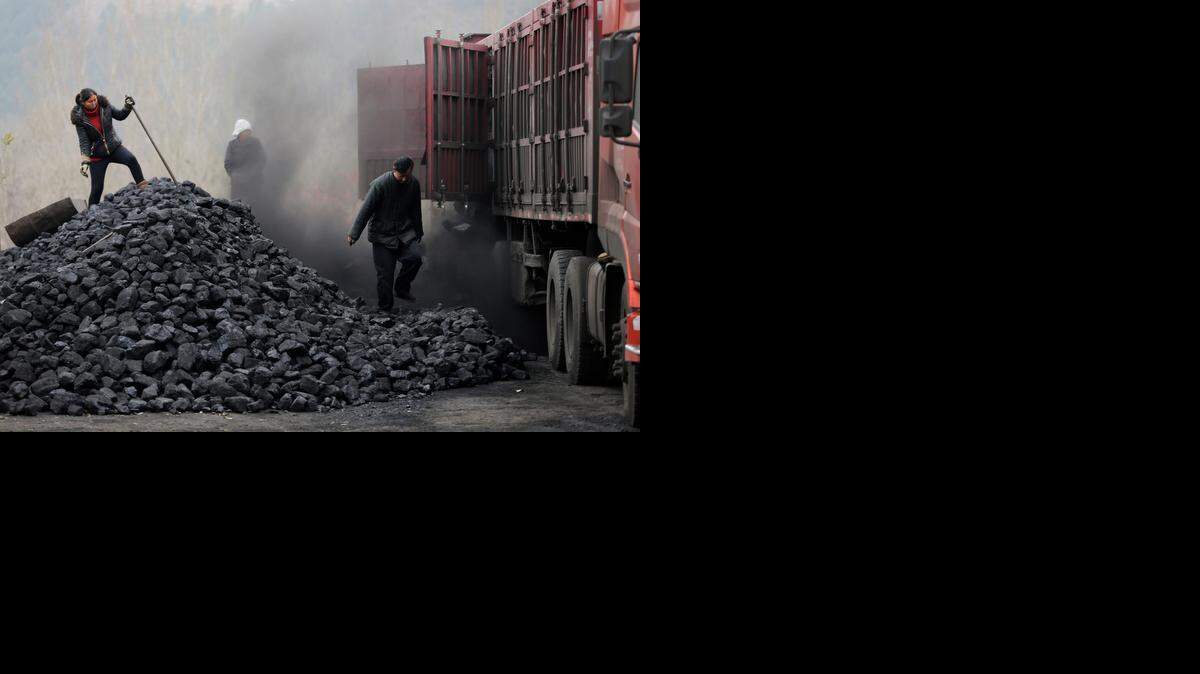 
Workers load coal from a truck at a process station for sale in Tangxian in China’s Hebei province. In the province, a few dozen miles from Beijing, coal use has long been a way of life. But residents of Tang County said they see change coming as Chinese leaders pledge to cut back on the kind of rampant coal use that has made this country the world’s biggest emitter of greenhouse gases.
