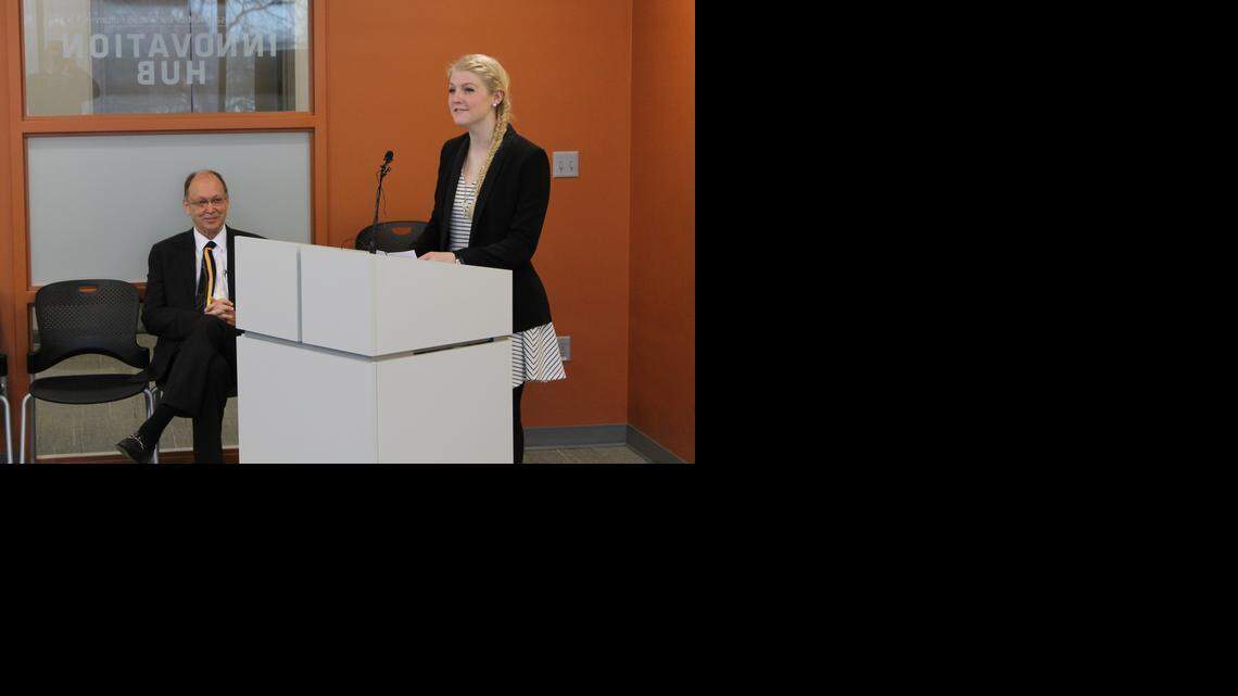 
Alyssa Ward, a senior at Wichita Southeast High School, speaks after being named the winner Wednesday of Wichita State University’s Clay Barton Scholarship in Business. At left is James Jordan-Wagner, interim dean of WSU’s W. Frank Barton School of Business.

