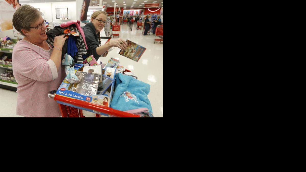
Melody Arnold, left, shops at the west Target Nov. 28 with her daughter. Black Friday’s sales likely will be surpassed this Saturday, according to a forecast from ShopperTrak.
