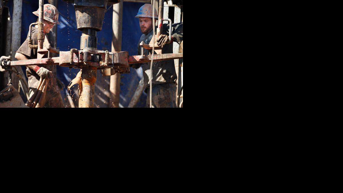 
Oil field workers drill into the Gypsum Hills near Medicine Lodge in 2012. Drops in crude prices have prompted oil producers in Kansas to reconsider aggressive drilling programs they had planned for 2015.
