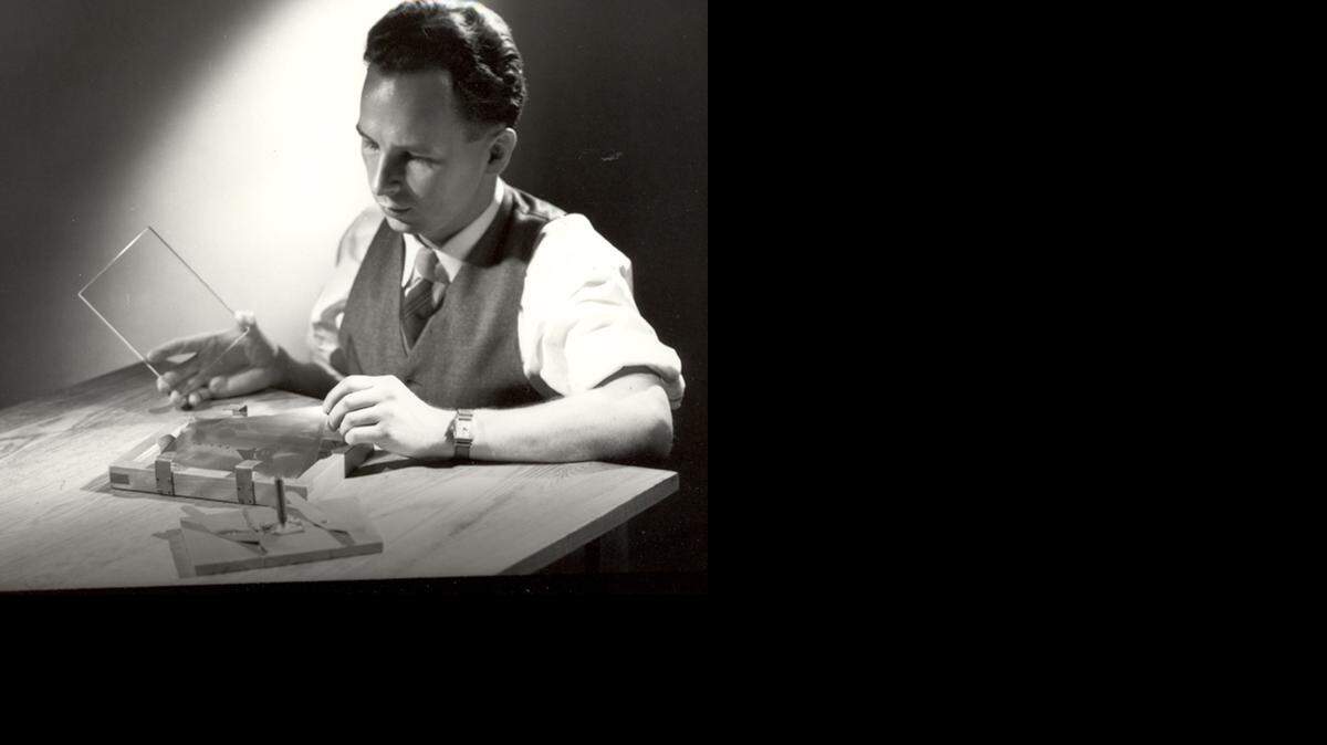 
In this 1950 photo provided by Corning Inc., Don Stookey prepares to expose an image to ultraviolet light. Stookey, who forever changed cooking with the invention of CorningWare, died Tuesday in Rochester, N.Y. He was 99.
