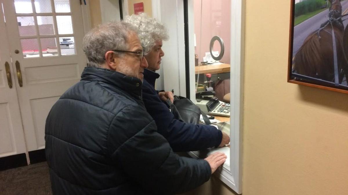 Gail Trachtenberg and Lewis Eron prepay part of their 2018 property tax bill at the township building in Cherry Hill, New Jersey, on Dec, 22. People across the country have been trying to prepay property taxes before a federal tax overhaul kicks in and caps deductions for state and local taxes.