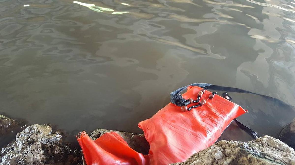 Chris Anaya was fishing on the Arkansas River on Saturday when he discovered half of a life vest on the water’s edge under the bridge near the Keeper of the Plains. He said the rosary made him think the vest belonged to Brian Bergkamp, so he called 911.