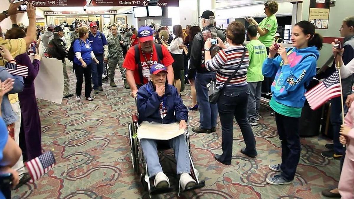 Military veterans return from Washington D.C., on an Honor Flight in 2014.