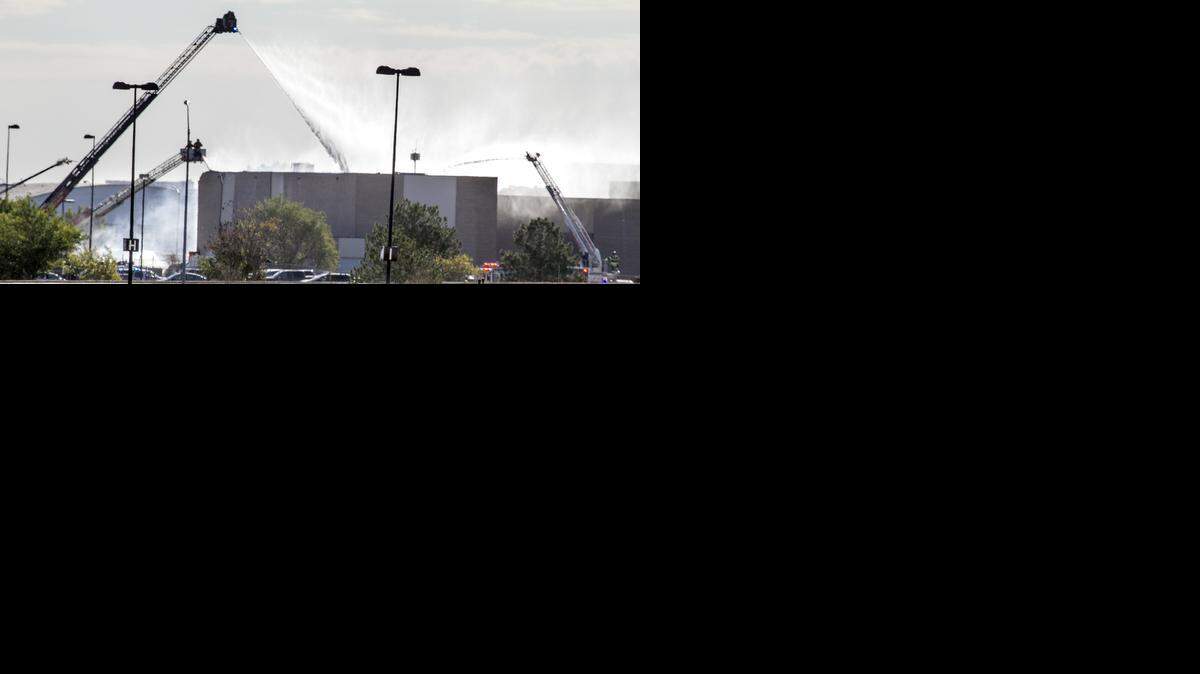 
Firefighters at Mid Continent Airport Thursday morning where a King Air plane reportedly crashed into the FlightSafety Building. (Oct. 30, 2014) 
