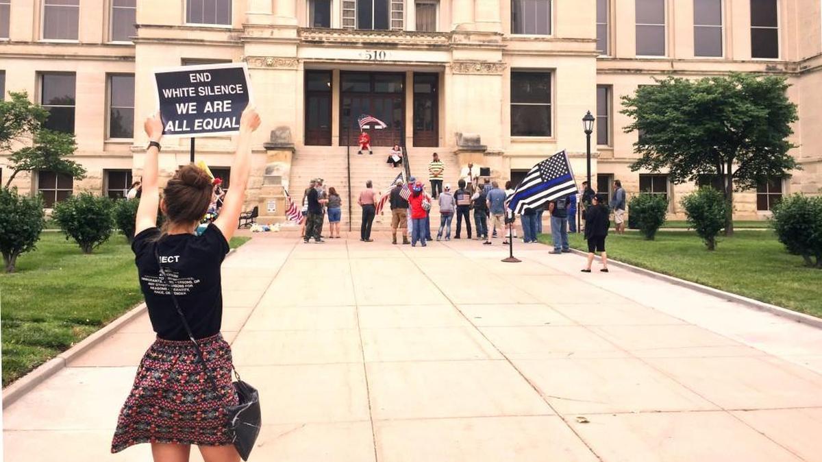 About 35 people gathered – along with a few counterprotesters, like the woman in the foreground – at the Historic County Courthouse in downtown Wichita on Saturday to publicly oppose Islamic law. The gathering was mostly peaceful.