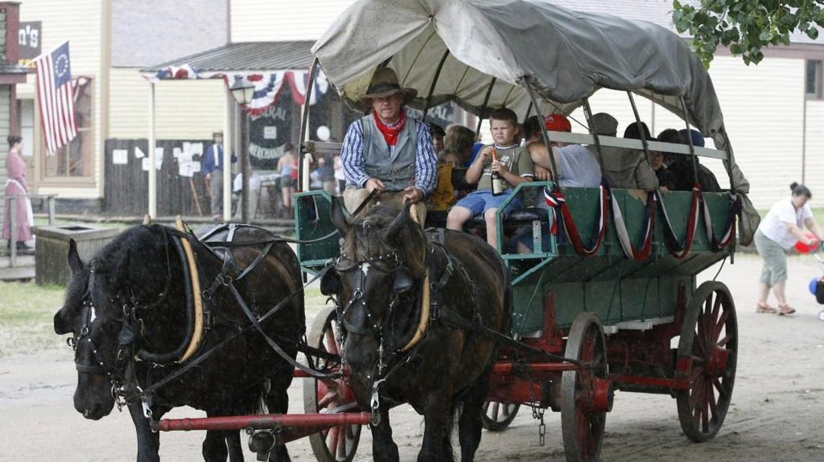 A covered wagon takes passengers down the streets of Old Cowtown Museum. Kansans for Life will hold a “Faith, Family, Pro-life Cowtown Extravaganza” on June 26 at the living history museum.