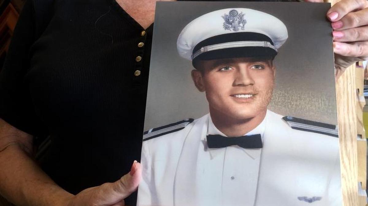 Deanna Klenda, with a photo of her brother, Dean, declared missing during the Vietnam War in 1965. Funeral services for him will be 11 a.m. Saturday at St. John Nepomucene Church in Pilsen, Kan.