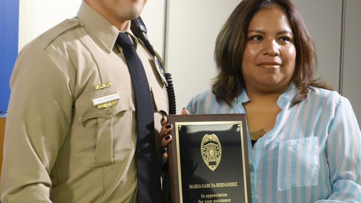 Maria Garcia-Hernandez received the outstanding citizens award from Wichita police for her help in apprehending a burglary suspect in June.