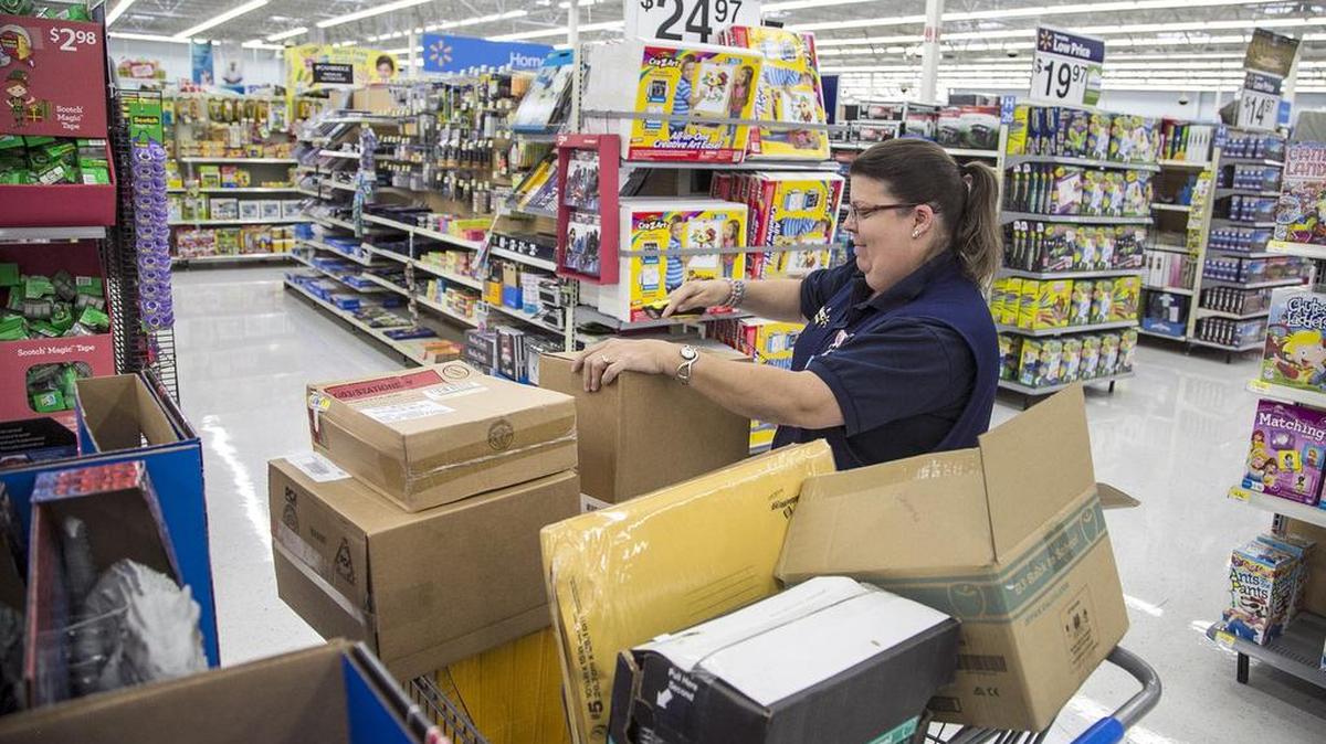 Sharon Thompson unpacks merchandise at Walmart on East Kellogg in preparation for Black Friday sales.