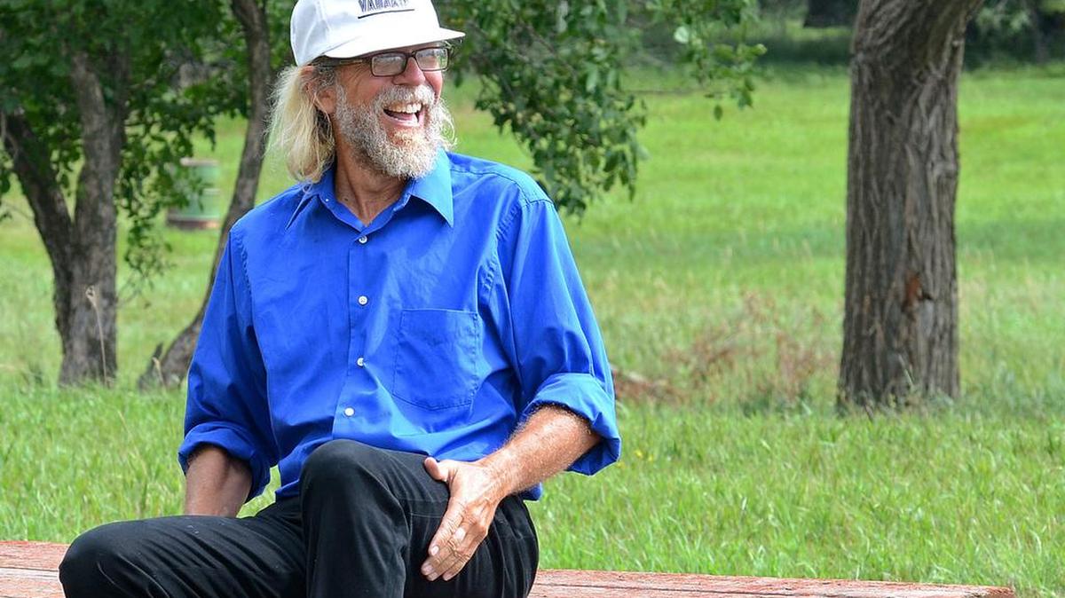 
White supremacist Craig Cobb sits on a picnic bench in Leith, N.D., in 2013.
