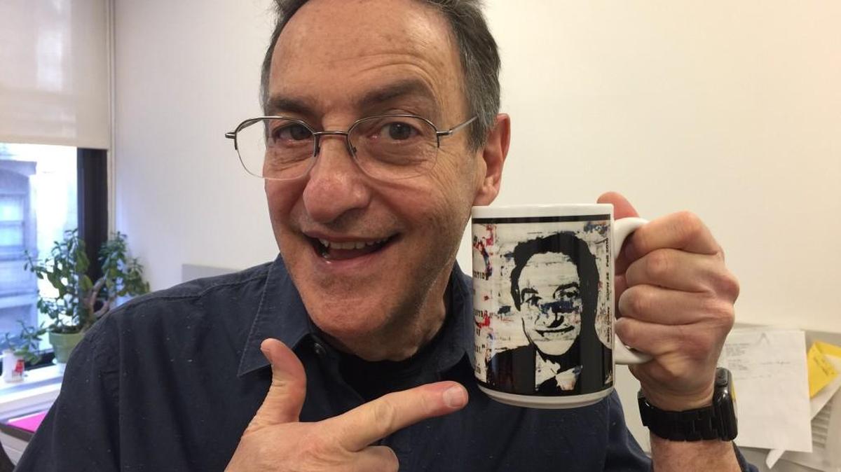 Ira Flatow, host of the NPR show “Science Friday,” shows off a KMUW mug that features his face.
