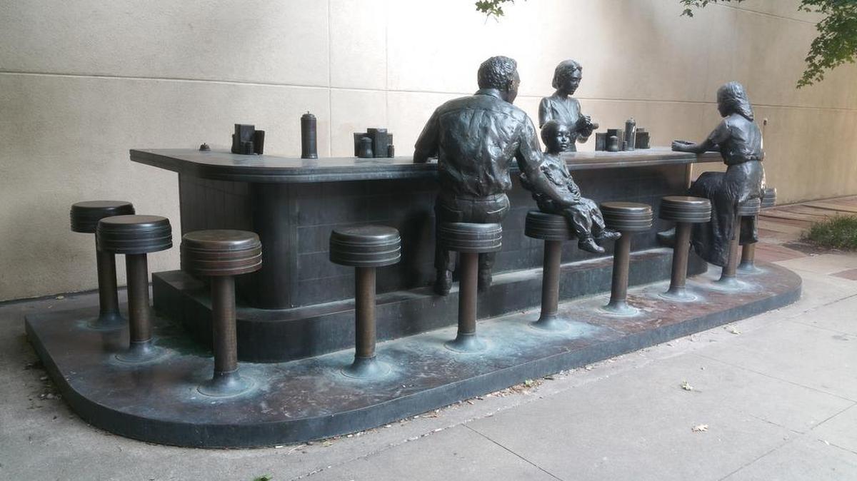
The bronze sculpture in Chester I. Lewis Reflection Park commemorates the 1958 Dockum Drugs sit-in, which took place at the corner of Douglas and Broadway.

