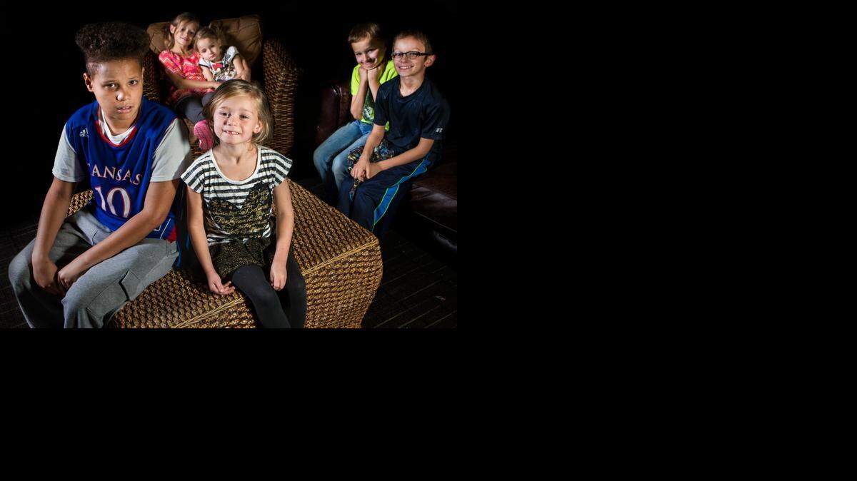 
Siblings (foreground, from left) Christian, 14; Taylor, 6; (background, from left) Ally, 10; Lynzee, 4; Tyson, 8; and Raymond, 9; are photographed on Nov. 6 at St. Francis Community Services in Wichita.
