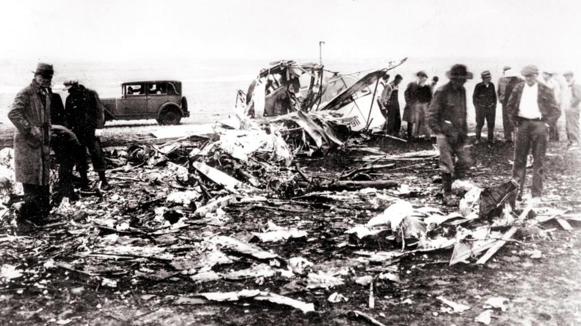 Searchers are shown at the site of a plane crash that killed six passengers, including Knute Rockne, Notre Dame football coach, and two pilots near Bazaar, Kan., on March 31, 1931. The Transcontinental and Western Air Inc. mail transport lost a wing and spun down out of stormy skies into a wheat farm with tremendous force. Five bodies were thrown from the wreckage, while three were found mutilated in the wreckage. The broken wing descended on a nearby hilltop.