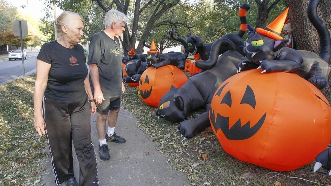 D.J. and Dale Spaeth look over their Halloween inflatables Tuesday in their College Hill neighborhood. The Spaeths had four inflatables stolen over the weekend and hope someone knows something about it. (Oct. 20, 2015)