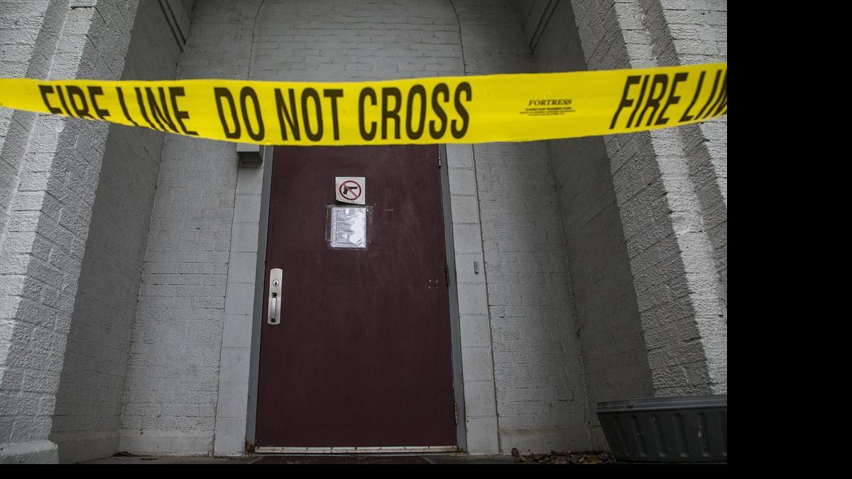 
Fire line caution tape remains across a doorway to the DCCCA Women’s Recovery Center following a ceiling collapse that injured 10 people during a group meeting Wednesday night. (May 14, 2015) 
