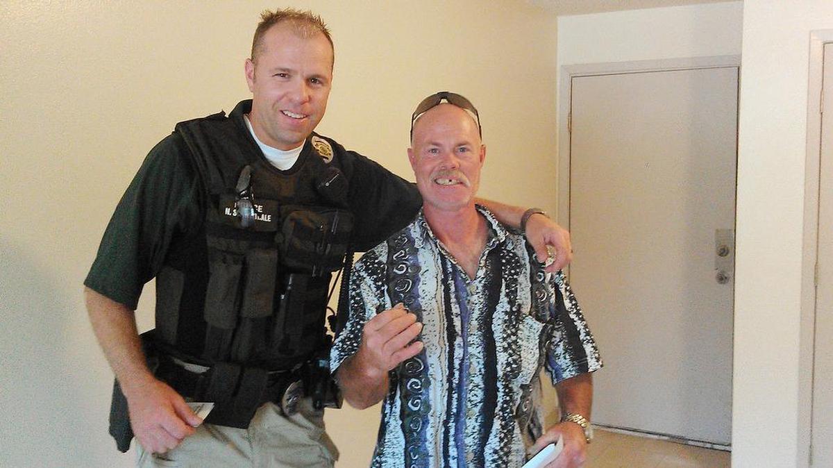 Wichita police Officer Nate Schwiethale stands with Fred Linker, aka “Rooster.” Schwiethale played a large part in getting Linker off the streets as a homeless person.