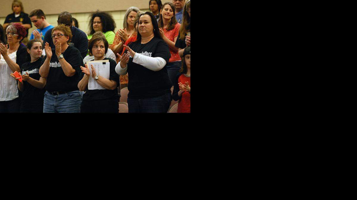 
Supporters of awarding the same athletic letters to special-needs athletes applaud speakers at the Wichita school board meeting on Monday evening.
