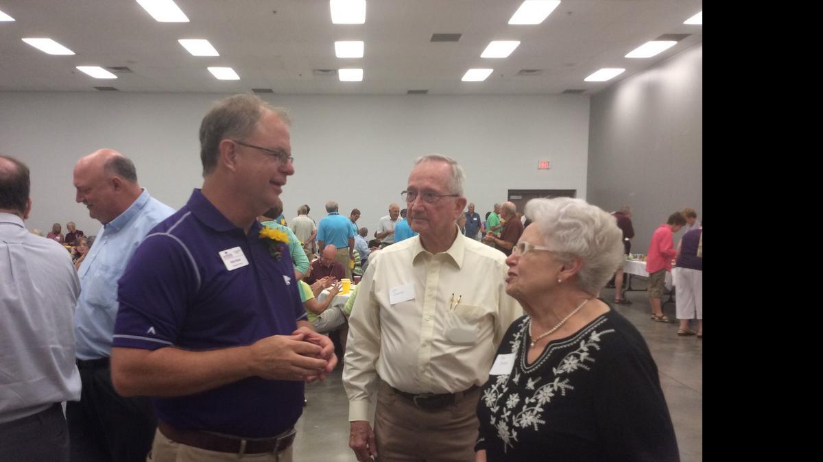 
Extension agent Bob Neier, left, visits with retired extension director Bev Dunning at his retirement reception Friday at the Extension Center.
