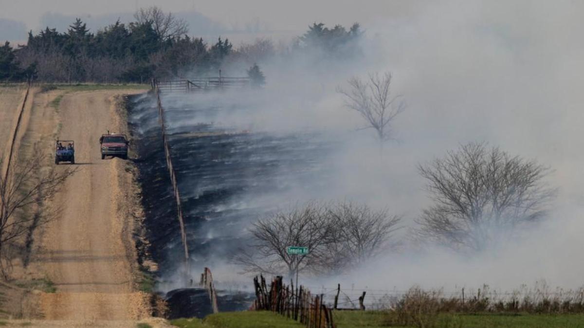 A controlled pasture fire burns near Alta Vista on Wednesday. Smoke from burning in the Flint Hills has spread as far north as Omaha, prompting Nebraska counties to issue health advisories.