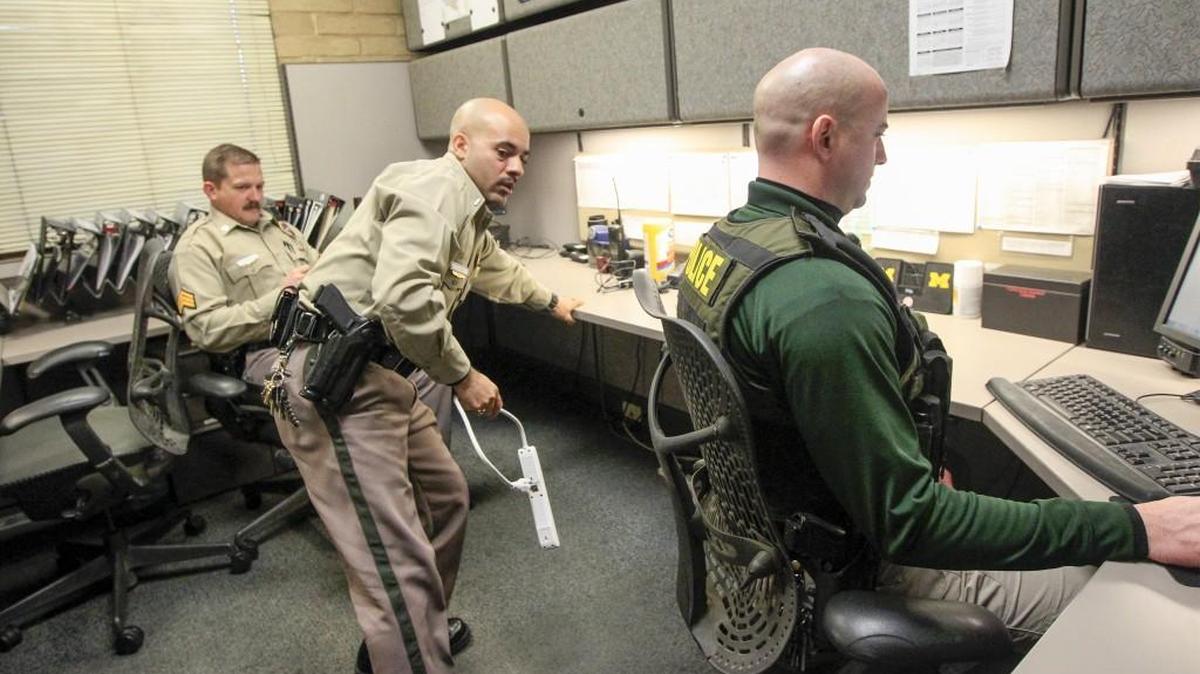 East-side Lt. Patrick Leon moves things around to make room in a supervisors office at the east-side station Wednesday. "Sometimes we have to use the supervisors office to conduct interviews," he said. (Jan 23, 2017)