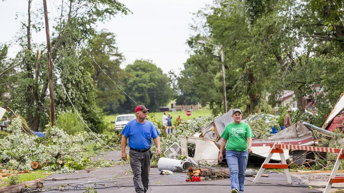 Rick and Becky Stever check on their friends’ welfare Friday morning after a tornado hit Eureka on Thursday night. (July 8, 2016) 