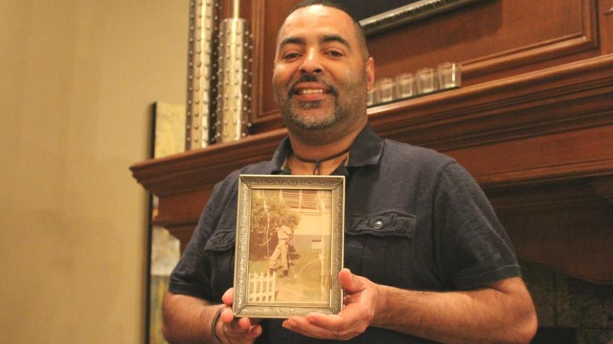 Cassius Davis, 50, keeps a photo of his father, Bobby Ray Bryant, who died in Vietnam when Davis was 5 months old.